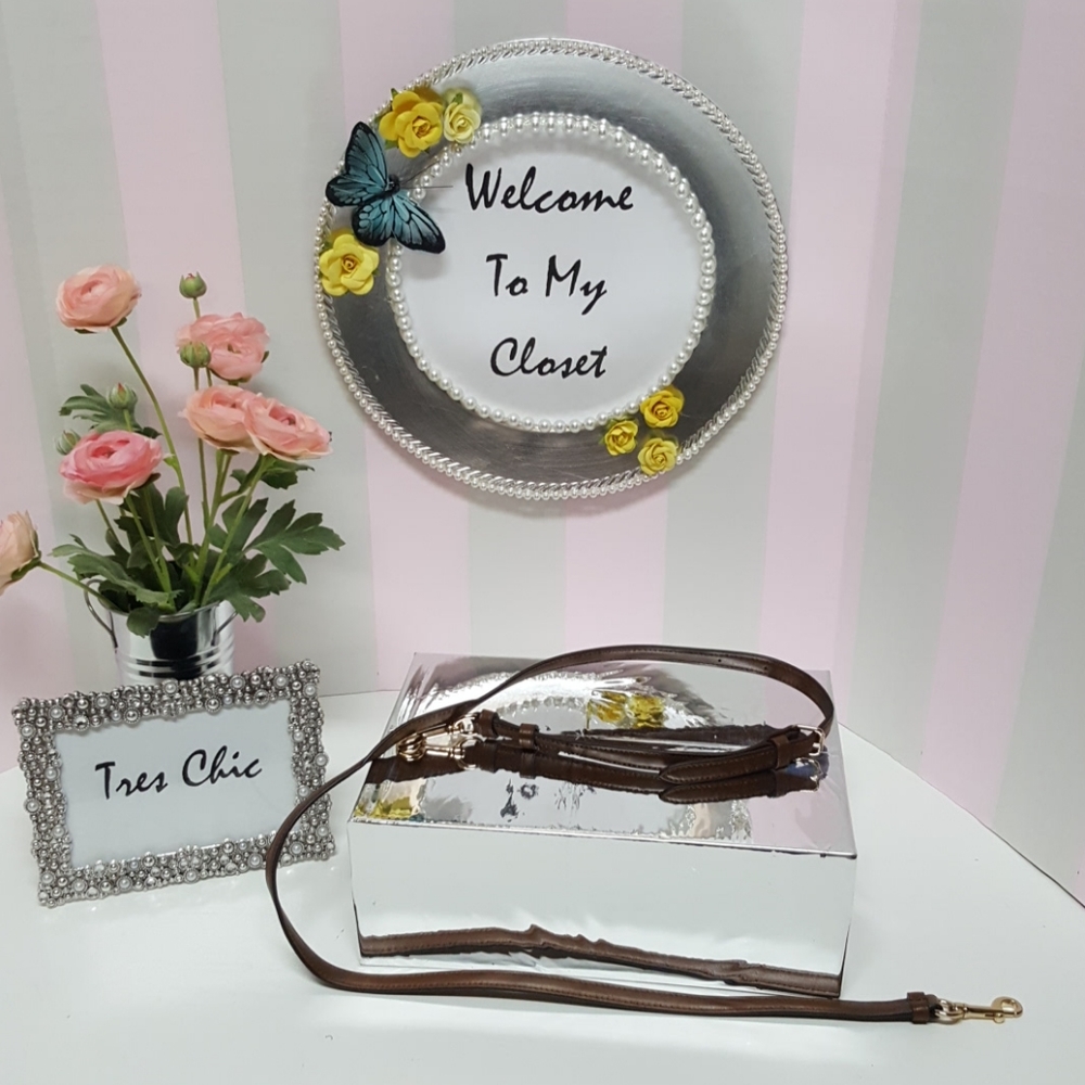 Brown purse shoulder strap